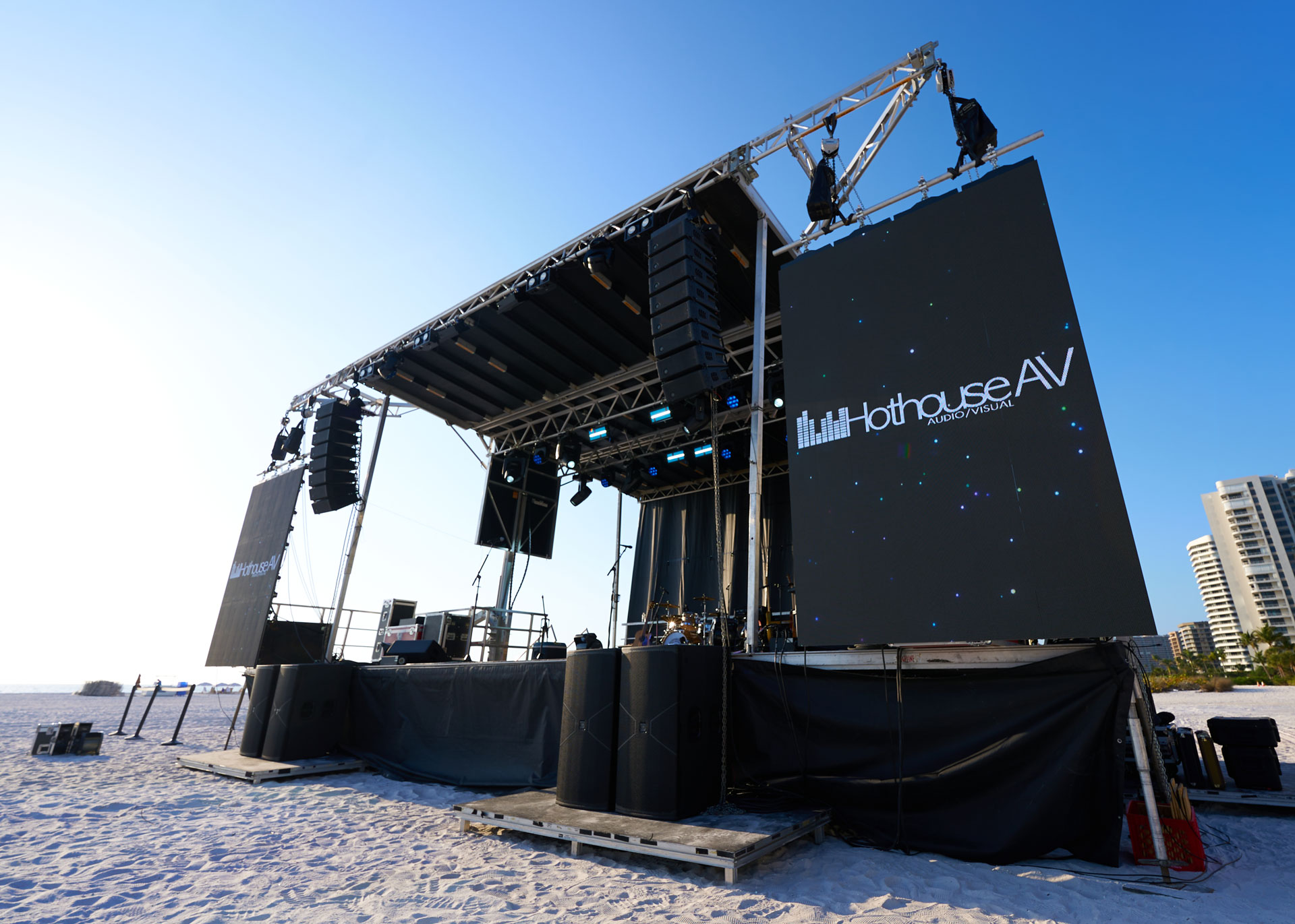 Professional audio setup by HOTHOUSE AV with high-quality speakers, microphones, and mixing equipment at a live event.